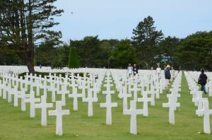 White crosses of the victors at Omaha beach; across the road are the dark ones.